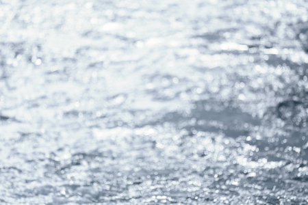 Abstract bokeh of sea in the morning for design nature background.の写真素材