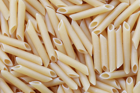 Raw Macaroni background for design food backdrop.