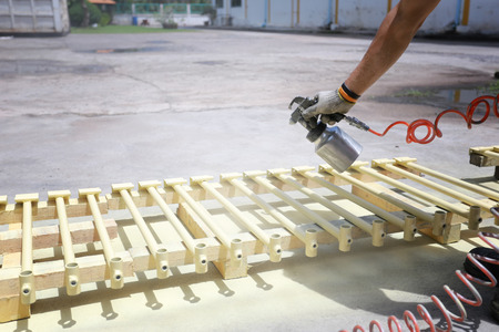 Workers spraying automotive parts in Concept of work manufacturing industry.