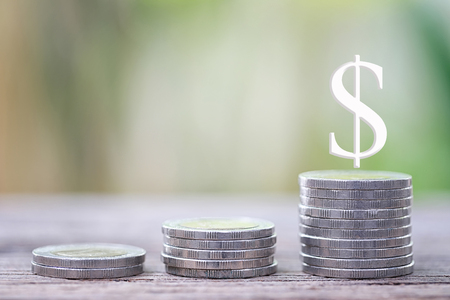 Silver coin of Business graph in growth concept of profit and investment.