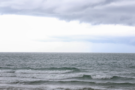 Sea beach and rain cloud sky,Coastal storms are coming.の写真素材