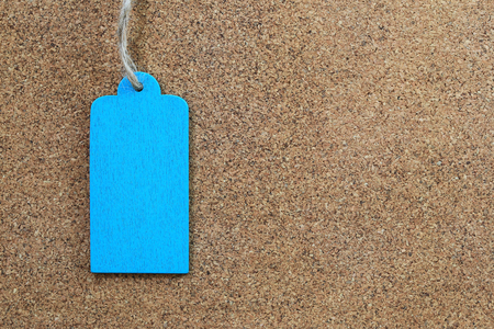 Blue empty wood sign on wooden cork background for input text in your want and have copy space.の写真素材
