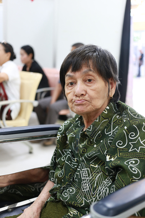 Old Asian woman sitting in wheelchair in hospital,concept of health care.の写真素材