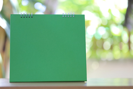 Blank paper calendar on the wooden floor and have copy space in design idea of your work.の写真素材