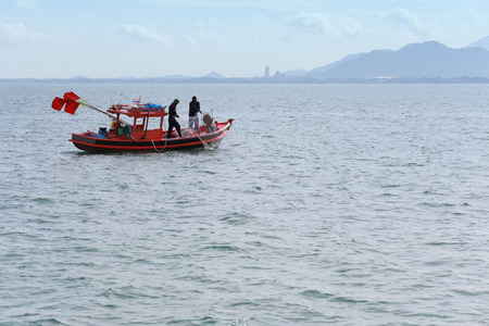 Thai people and fishing boats in the sea of Thailand,Coastal lifestyle of Thai community.