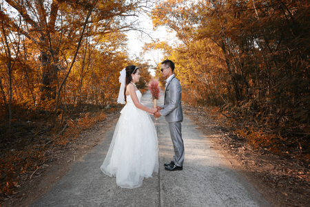 Asian couple photographed before marriage is Pre-wedding on Koh Si Chang Island Popular locations in the Chonburi province at Thailand.の写真素材