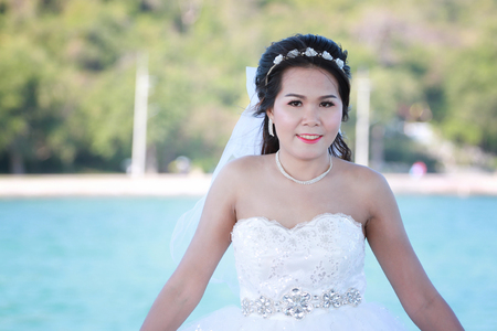 Asian bride photographed before marriage is Pre-wedding on Koh Si Chang Island Popular locations in the Chonburi province at Thailand.の写真素材
