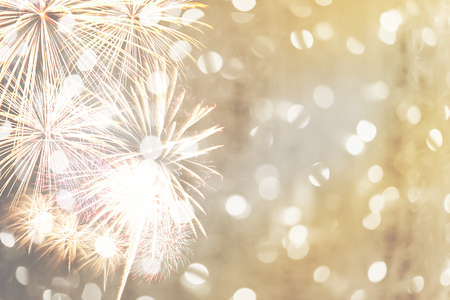 New year fireworks on golden bokeh background and have copy space for design idea in your work.の写真素材