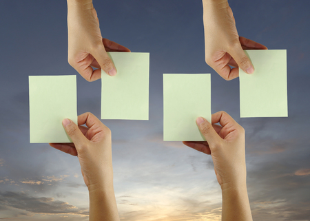 Hand of businessman hold empty note paper for design idea in business concept to input on your work.の写真素材