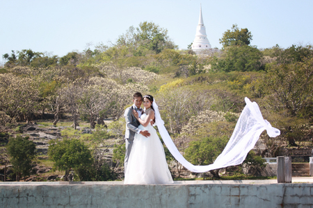 Asian couple photographed before marriage is Pre-wedding on Koh Si Chang Island Popular locations in the Chonburi province at Thailand.の写真素材