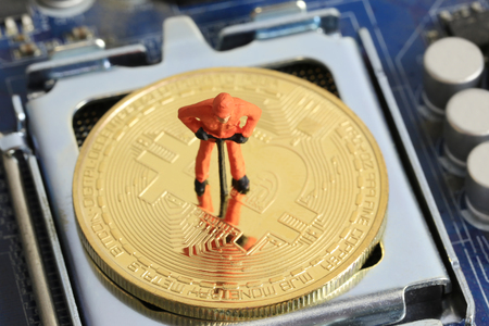 Model people of miners are standing on the gold bitcoin for design in digital concept cryptocurrency or bitcoin currency.の写真素材