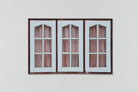 Old vintage wood window on gray wallの写真素材