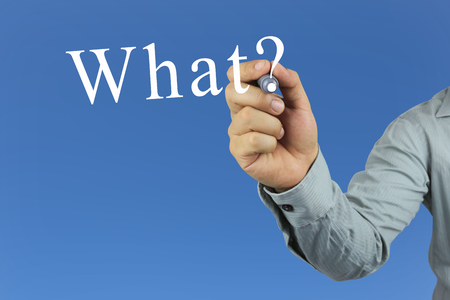 Hand of businessman hold the pen pointing to what? text on blue background for design concept of presentation or academic.の写真素材