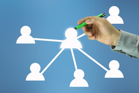 Hand of businessman point to a symbol person on blue background for design in your work personnel management concept.の写真素材