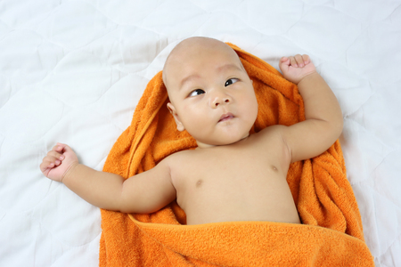 Asian Infant in a surprised on face Feeling,concept of healthy growth.の写真素材
