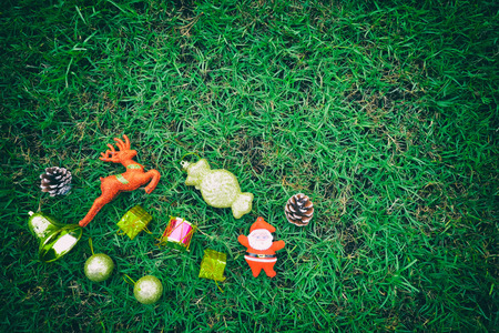 Equipment for Christmas decoration on green lawn background and have copy space to your design.の写真素材