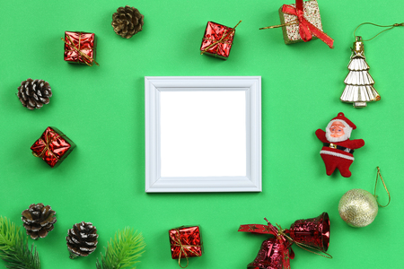 Christmas decoration equipment and photo frame on green paper art background with copy space for your design.の写真素材