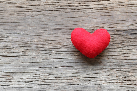 Heart on the wooden floor and have copy space for design in your love or Valentine day Concept.の写真素材