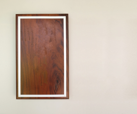 Empty brown wood frame on gray cement wall for design in your work concept.の写真素材