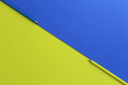 Yellow and blue pencil color on art paper and have copy space for design in your work concept.