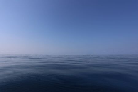 Smooth sea and blue sky in daytime with Clear air for design in your work concept.