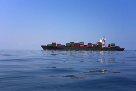 Cargo ship on the sea in a clear day and clear sky,concept of sea transportation.
