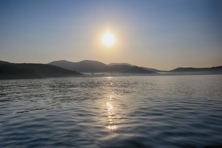 Sunrise from the island in the sea,Landscape of sea and mountains in the morning with bright...