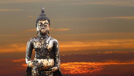 Buddha statue on twilight sky background and have copy space for design in your work concept.の写真素材