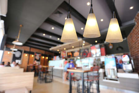 Modern lamp hanging from the ceiling of the restaurant for design in your work Interior concept.の写真素材