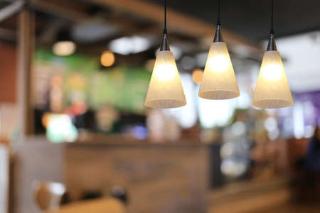 Modern lamp hanging from the ceiling of the restaurant for design in your work Interior concept.の写真素材