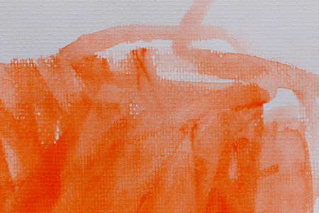Orange watercolor on art paper background for design in your work texture concept.の写真素材