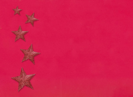 Red star on the red paper background and have copy space for design in your new year and christmas...