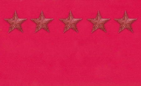 Red star on the red paper background and have copy space for designの写真素材