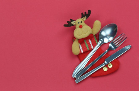Cutlery set on red background and have copy space for design in your Eating food at Christmas and New Years concept.の写真素材
