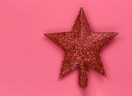 Red star placed on a red background and have copy space for design in your Christmas and New Year...