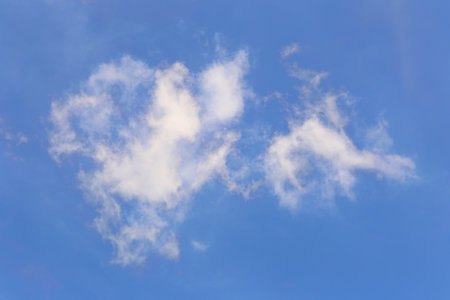 Blue sky with white clouds in the daytime background for design in you work idea concept.の写真素材