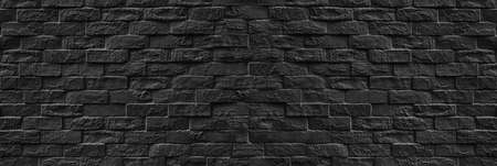 Panorama Surface of Vintage black brick wall background for design in your work Texture backdrop...
