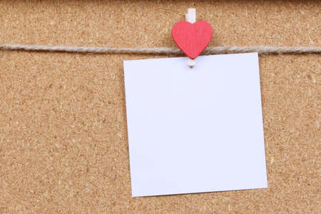 à¸ºBlank note of white paper hang on hemp rope the wooden wall and have copy space.