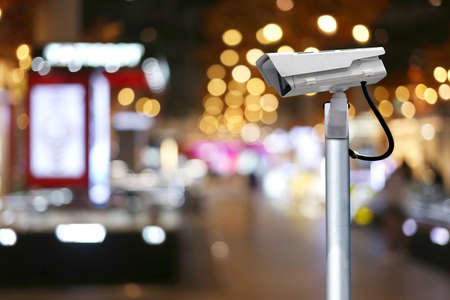 CCTV system on blur road at night background and have copy space for design in your work.