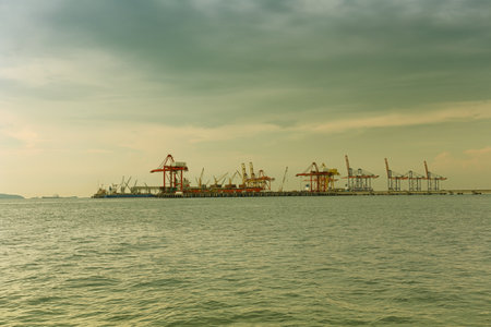 View of a working deep sea port in vintage colors, Loading and unloading of cargo ships.