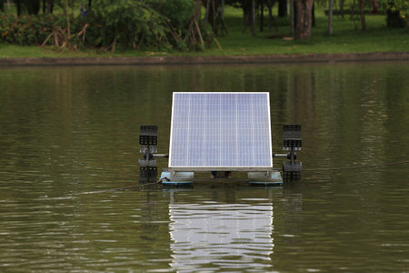 Solar water turbine with off system in a pond, Clean energy that can reduce the use of electricity.の写真素材