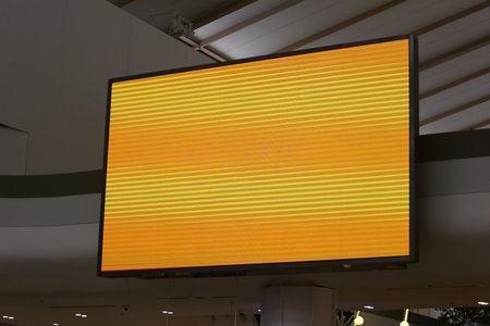 A large TV or projector screen with an orange background in screen, Large screen that can be...