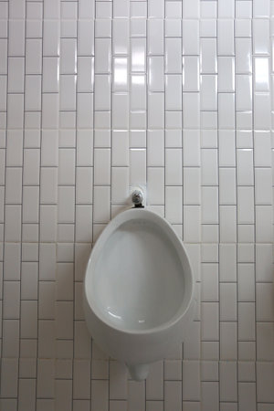 White urinals in the men's bathroom of interior decoration for design in your work concept.の写真素材
