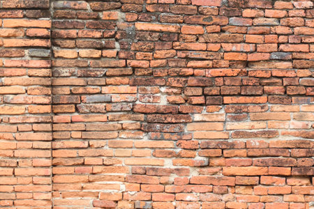 Surface of the red brick wall is old, dirty and covered with black mold for design in your work...
