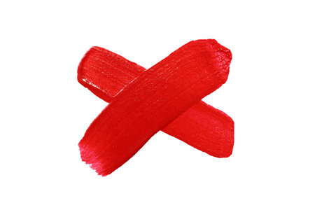 Vibrant red paint crosshairs or cross brush stroke isolated on white background and have clipping...