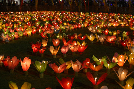 Candles are lit in colorful lanterns at the Loi Krathong festival in Khon Kaen province, Thailand.の写真素材