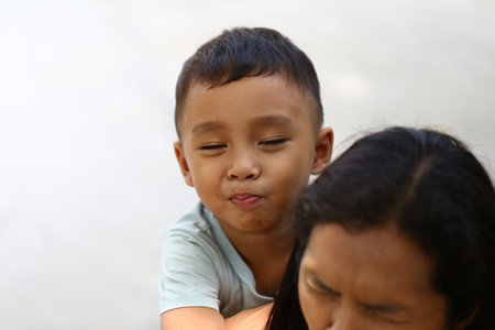 A joyful moment captured of a child enjoying playtime with a parent, showcasing the warmth and...