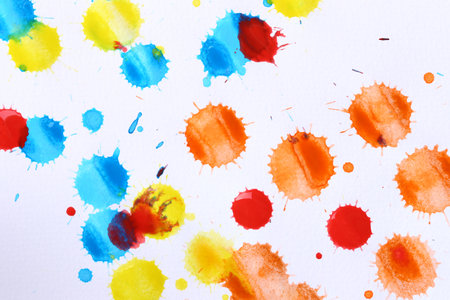 Various color paint drops on paper, causing dispersion of color, use it for design your work concept.の写真素材
