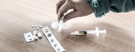 Person prepare different drugs to abuse on a table.の写真素材