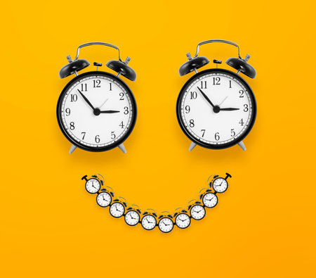 Smile look made from clocks on yellow background, happy time conceptの写真素材